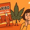 ハリボー ハッピーコーラのパッケージ、疑問そうな女性、大麻の葉がイラスト風に描かれた食品安全のイメージ画像